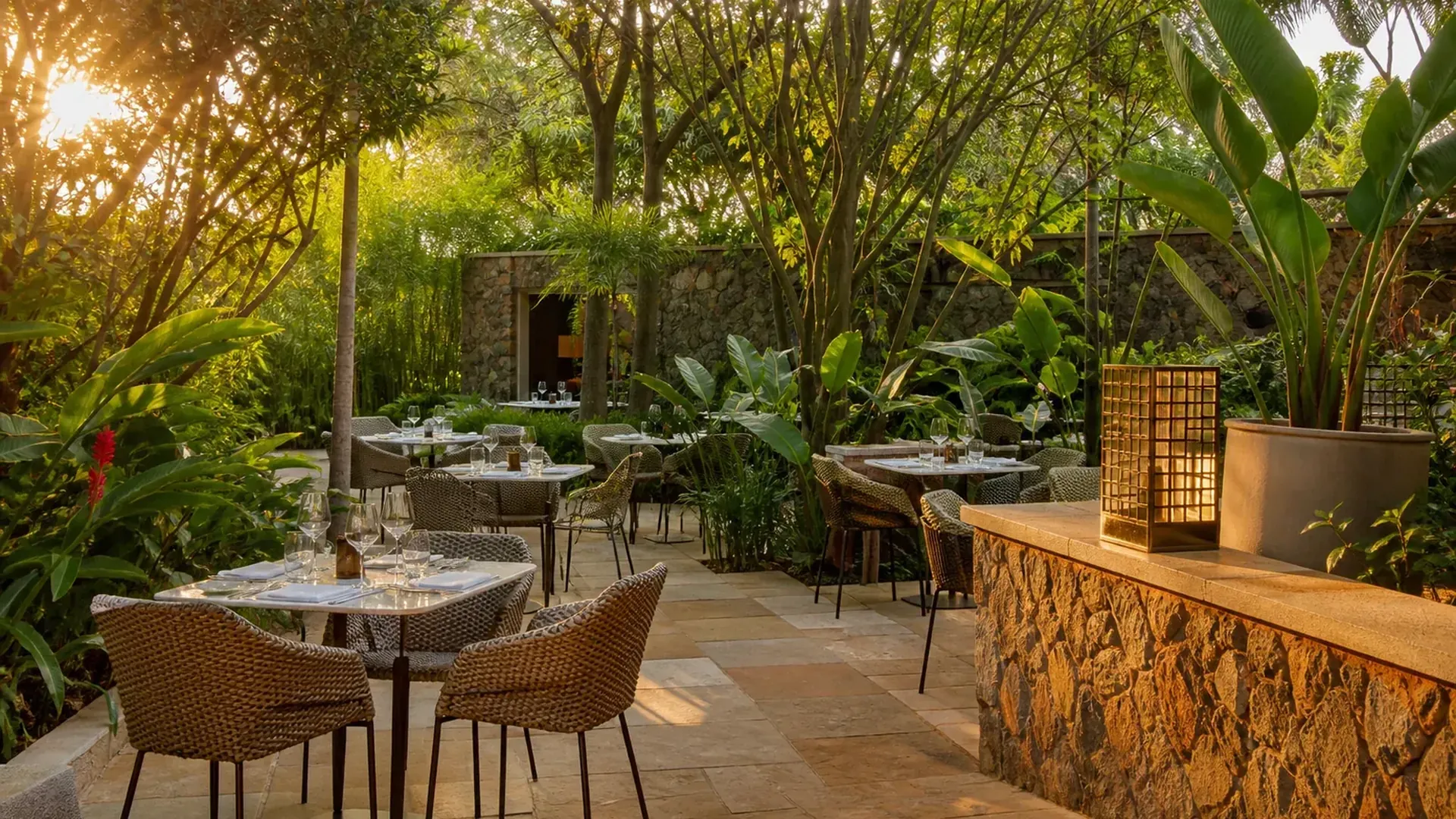 Walled garden with lush greenery and outdoor seating